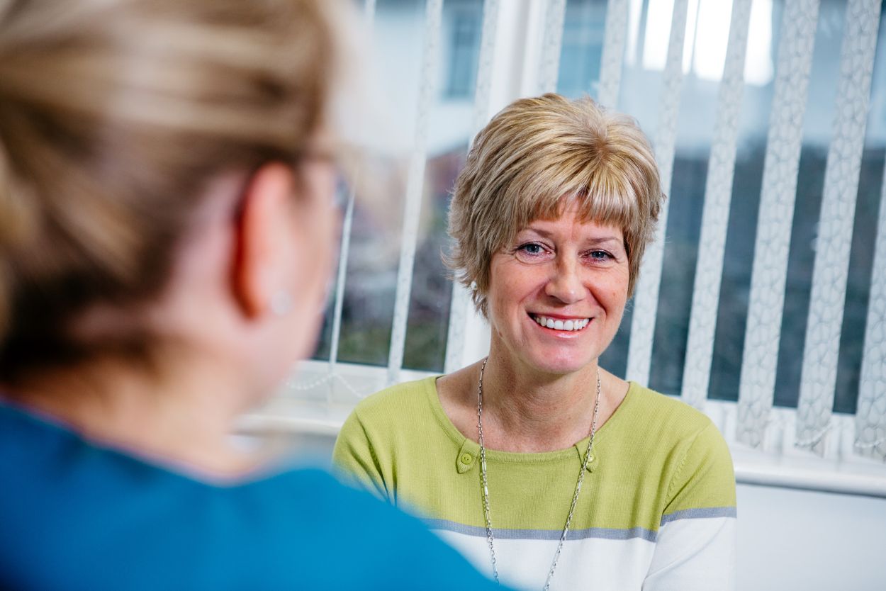 Dentist discussing teeth whitening with patient at Bourne Dental Practice